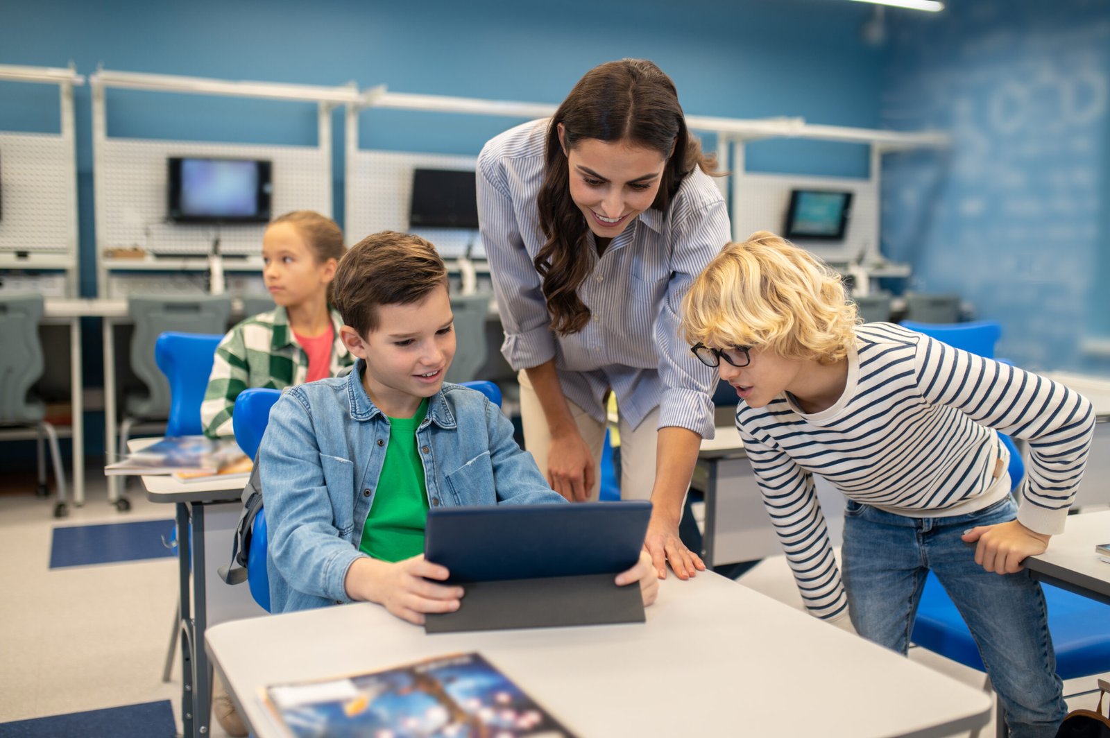 Teacher using AI tools to track student progress.